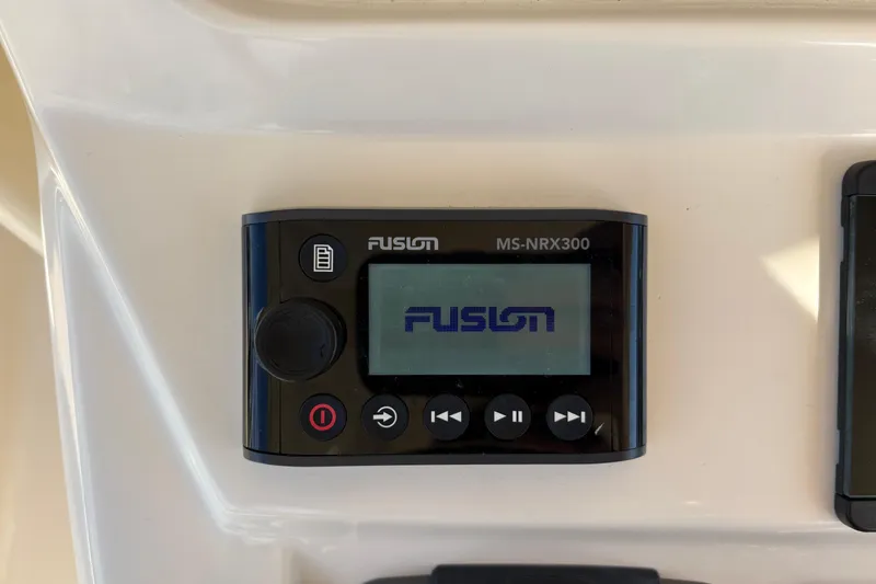 Slide: The Image of Fusion MS-NRX300 marine stereo on 2023 Scout 277 LXF boat dashboard. - 28