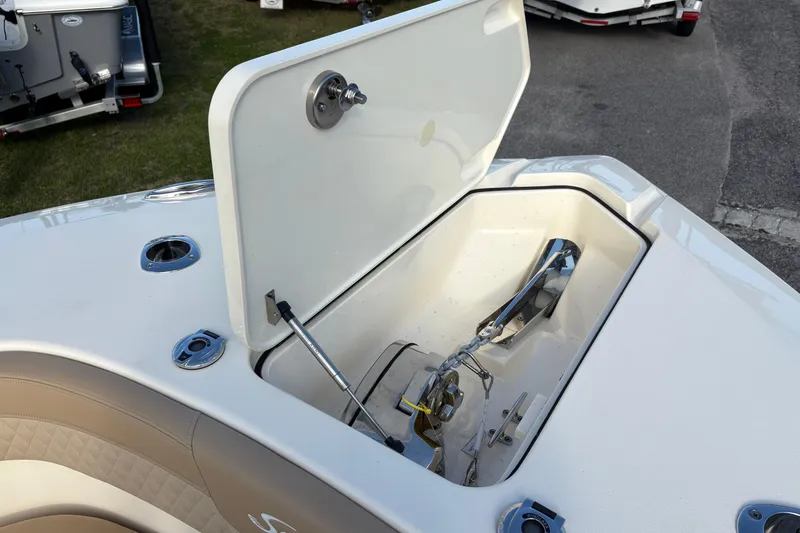 Slide: The Image of 2023 Scout 277 LXF boat anchor compartment with open hatch. - 40