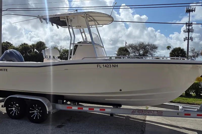 The Image of 2006 Grady-White Fisherman 222 boat on trailer under cloudy sky. - 0