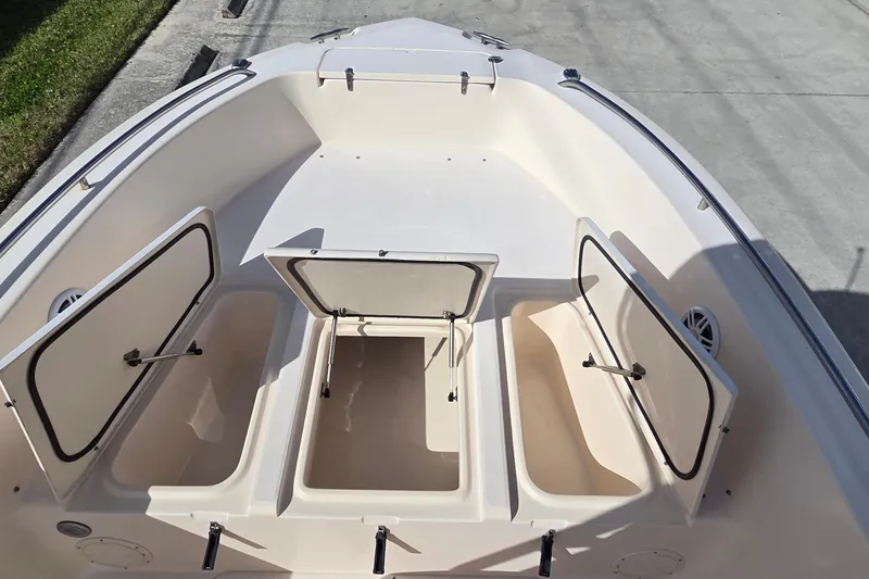 Slide: The Image of 2006 Grady-White Fisherman 222 boat interior with rod holders and steering console. - 11