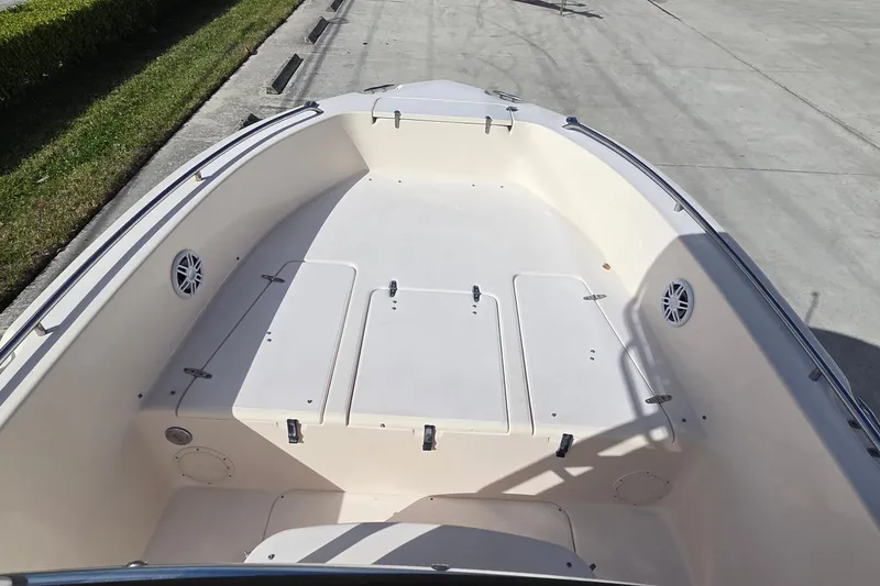 Slide: The Image of 2006 Grady-White Fisherman 222 boat with open storage compartments on deck. - 12