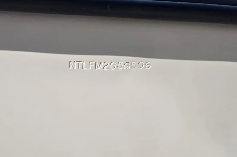 Slide: The Image of 2006 Grady-White Fisherman 222 boat deck, spacious and well-maintained, with storage compartments. - 13