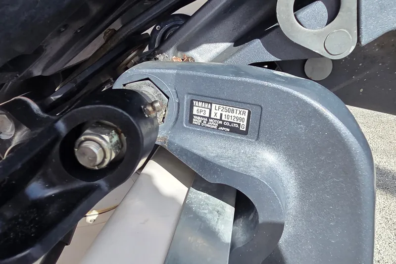 Slide: The Image of 2006 Grady-White Fisherman 222 boat console with steering wheel and controls. - 16