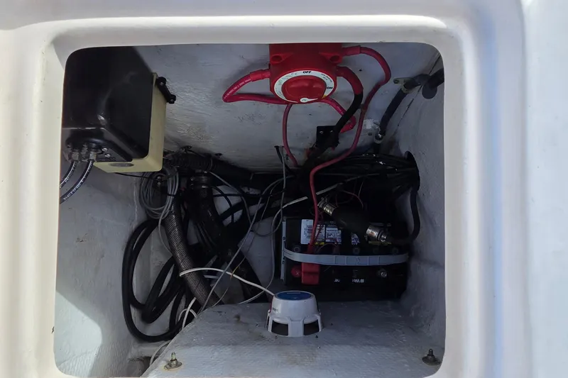 Slide: The Image of Electrical compartment of 2006 Grady-White Fisherman 222 boat, showing battery and wiring. - 3