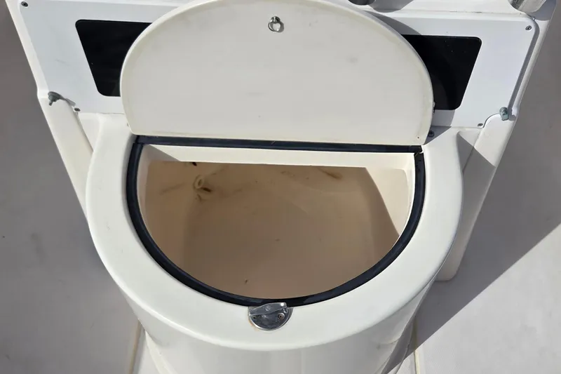Slide: The Image of Boat toilet on 2006 Grady-White Fisherman 222, open lid, white interior. - 4