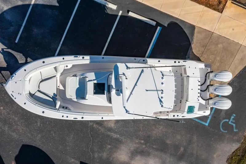 Slide: The Image of Aerial view of 2025 Edgewater 370CC boat in parking lot. - 1