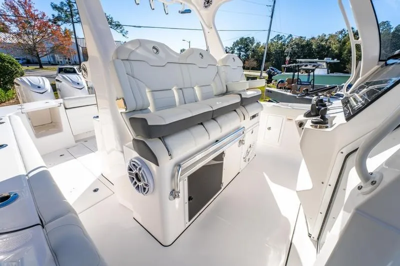 Slide: The Image of 2025 Edgewater 370CC boat interior with luxurious seating and modern controls. - 27