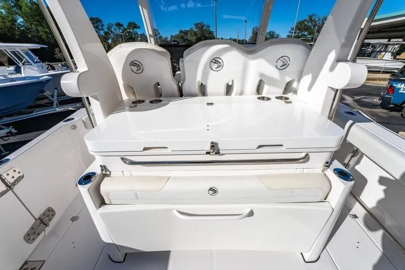 Slide: The Image of 2025 Edgewater 370CC boat interior with seating and storage compartments. - 29