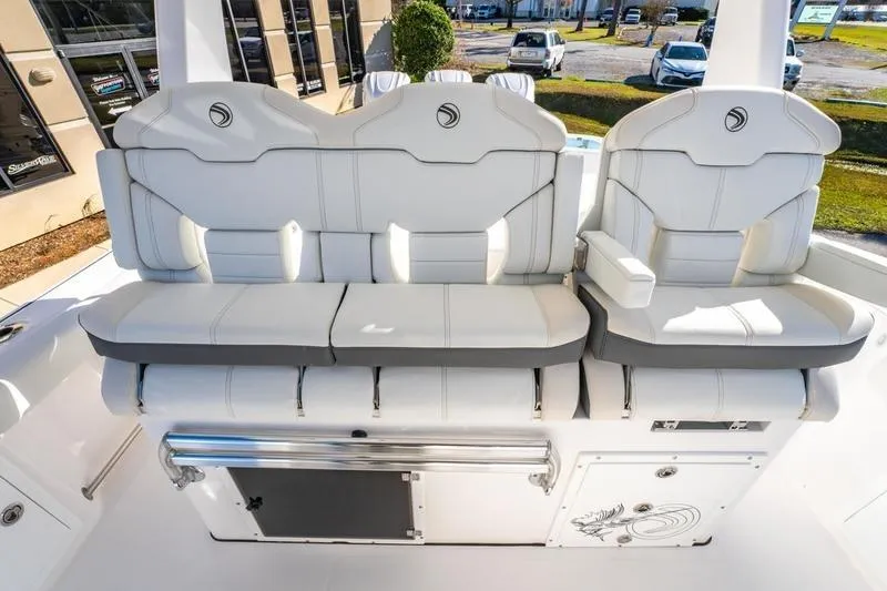 Slide: The Image of 2025 Edgewater 370CC boat interior with luxurious white seating and modern design. - 32