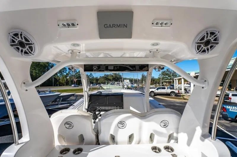 Slide: The Image of 2025 Edgewater 370CC boat interior with Garmin electronics and seating, showcasing modern design. - 35