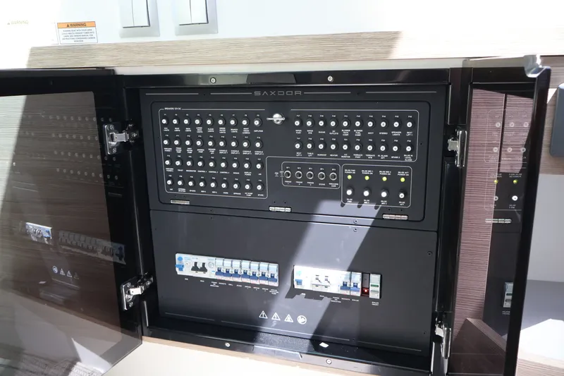 Slide: The Image of Electrical control panel on a Saxdor 400 GTO boat, featuring numerous switches and indicators. - 40