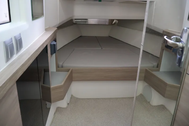 Slide: The Image of The 2027 Saxdor 400 GTO cabin features a modern, minimalist design with beige upholstery. - 37