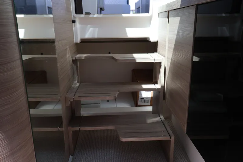 Slide: The Image of Interior of a modern yacht with wooden steps and mirrors leading to an upper deck. - 39
