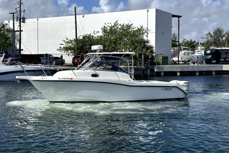 Slide: The Image of 2006 Boston Whaler 285 Conquest boat on water, side view, sunny day. - 13
