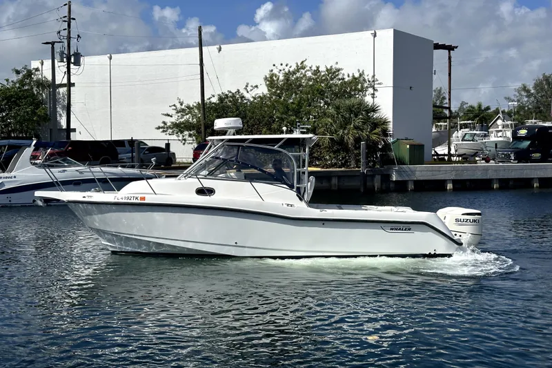 Slide: The Image of 2006 Boston Whaler 285 Conquest boat cruising on a sunny day. - 14