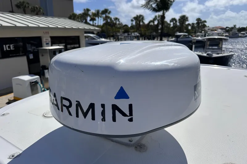 Slide: The Image of Garmin radar on 2006 Boston Whaler 285 Conquest, docked at marina with palm trees. - 35