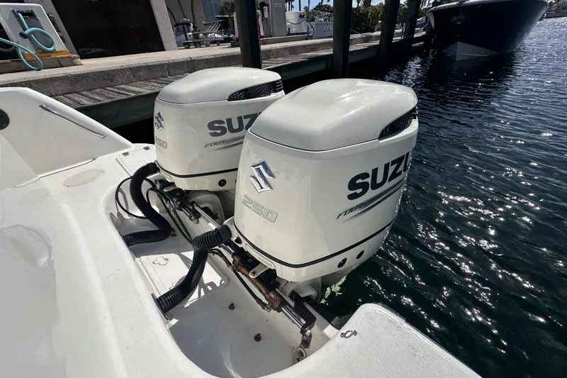 Slide: The Image of Twin Suzuki 250 outboard engines on a 2006 Boston Whaler 285 Conquest boat. - 40