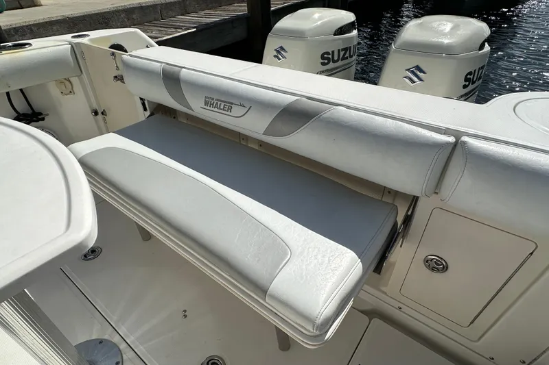 Slide: The Image of 2006 Boston Whaler 285 Conquest boat with Suzuki outboard engines and cushioned seating. - 46
