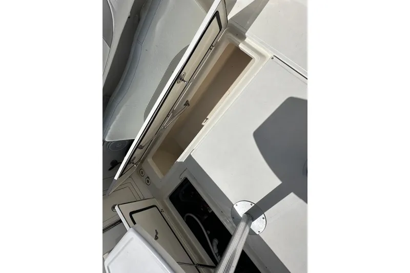 Slide: The Image of 2006 Boston Whaler 285 Conquest interior storage compartments and seating area. - 54