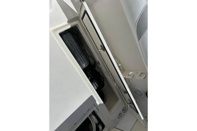 Slide: The Image of Open storage compartment on 2006 Boston Whaler 285 Conquest boat interior. - 55