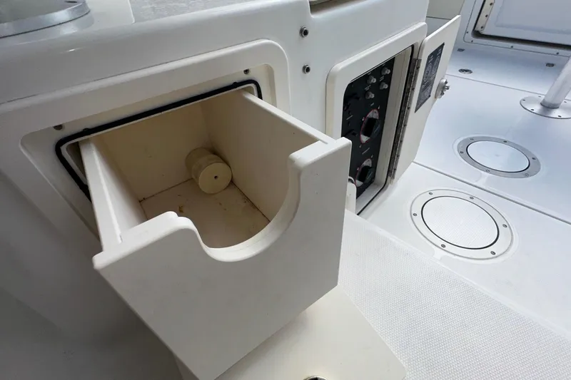 Slide: The Image of Open storage compartment on 2006 Boston Whaler 285 Conquest boat deck. - 87