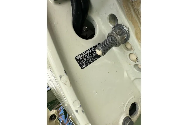 Slide: The Image of Close-up of a Suzuki motor part on a 2006 Boston Whaler 285 Conquest boat. - 96