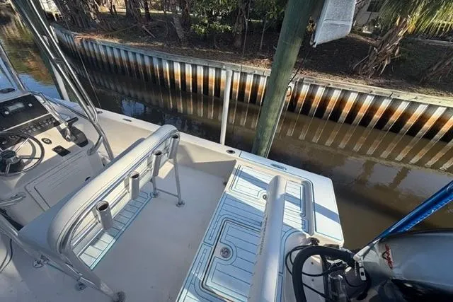 Slide: The Image of 2007 Pathfinder 2200 Tournament Edition boat docked by a canal. - 11