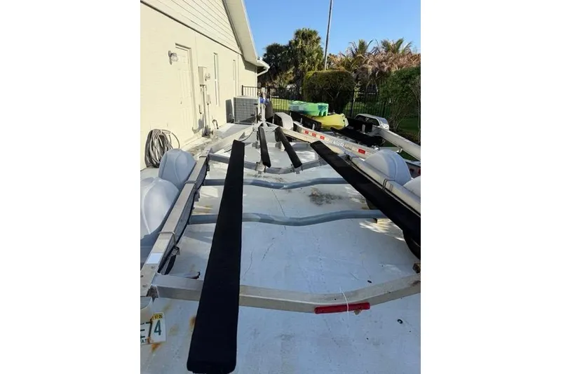 Slide: The Image of Boat trailer for 2007 Pathfinder 2200 Tournament Edition, parked outdoors near a building. - 15