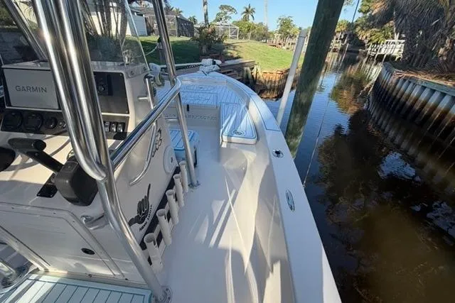 Slide: The Image of 2007 Pathfinder 2200 Tournament Edition boat docked by a scenic canal. - 6