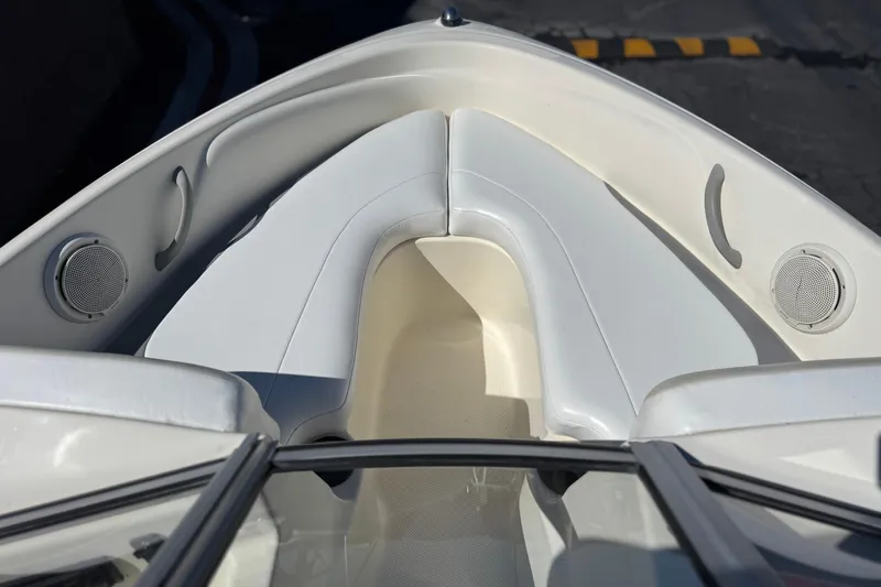 Slide: The Image of 2006 Bayliner 175 XT boat interior with white seating and built-in speakers. - 10