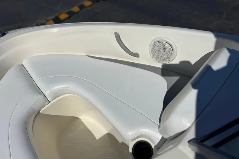 Slide: The Image of Interior of 2006 Bayliner 175 XT boat with white seating and speaker. - 12