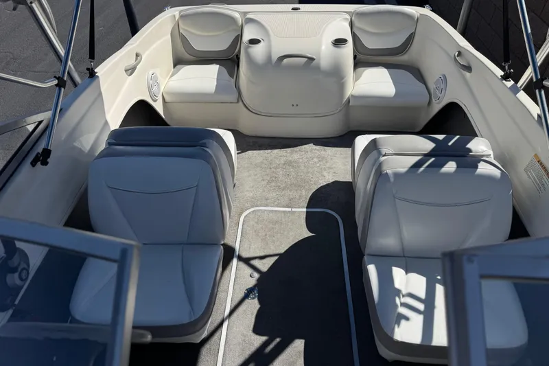 Slide: The Image of Interior of 2006 Bayliner 175 XT boat with white seating and carpeted floor. - 15