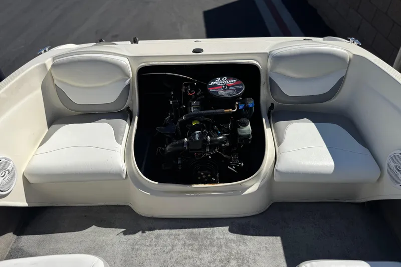 Slide: The Image of 2006 Bayliner 175 XT boat engine compartment with seating and speakers. - 16