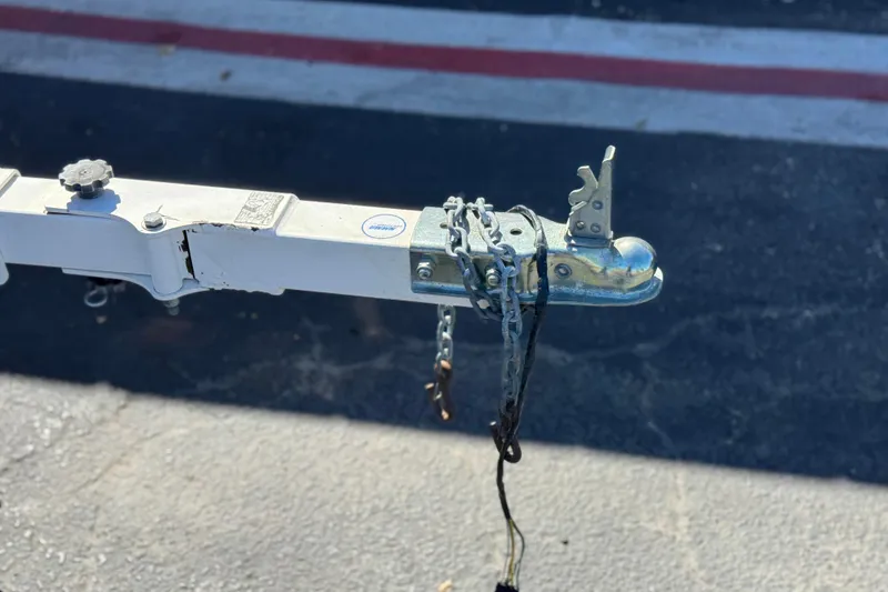 Slide: The Image of Trailer hitch of a 2006 Bayliner 175 XT boat, secured with chains. - 27