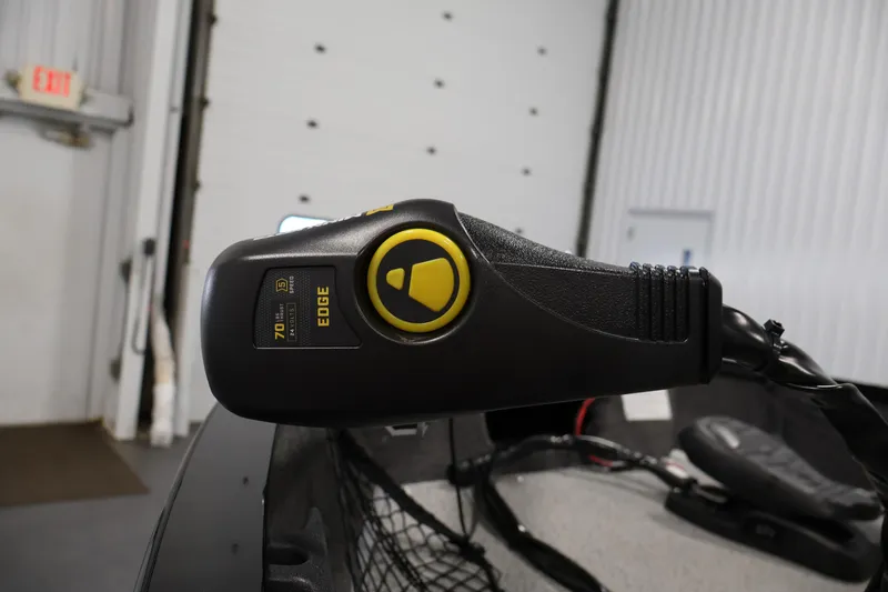 Slide: The Image of Close-up of 2024 Lowe Fishing Machine 1775WT trolling motor control in a garage. - 12