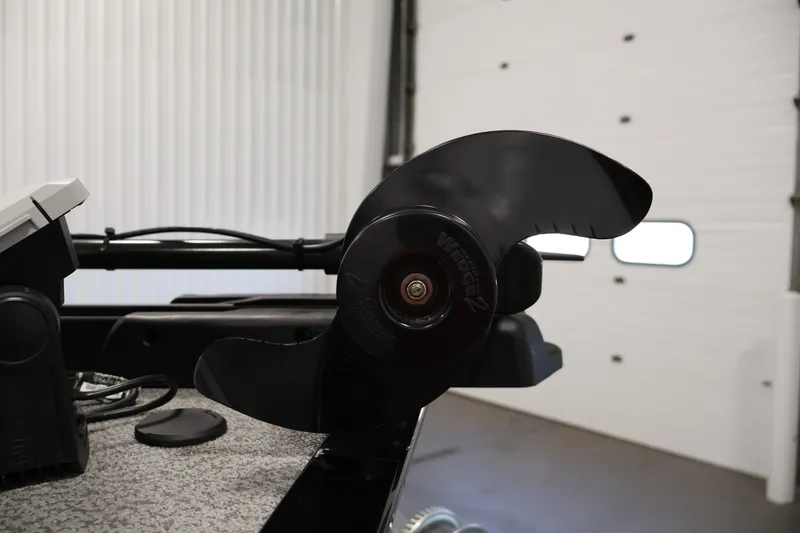 Slide: The Image of 2024 Lowe Fishing Machine 1775WT boat propeller in a garage setting. - 13