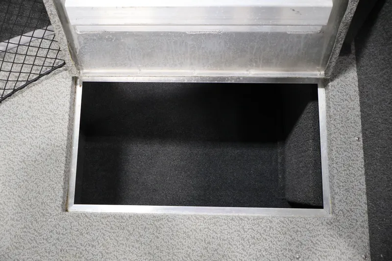 Slide: The Image of 2024 Lowe Fishing Machine 1775WT storage compartment with open lid, showcasing interior space. - 19