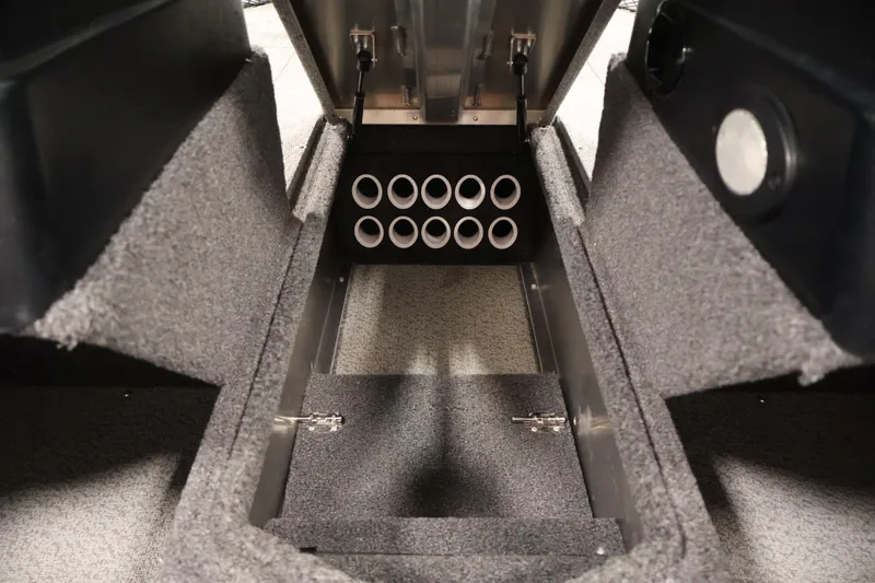 Slide: The Image of 2024 Lowe Fishing Machine 1775WT interior storage compartment with rod holders. - 20