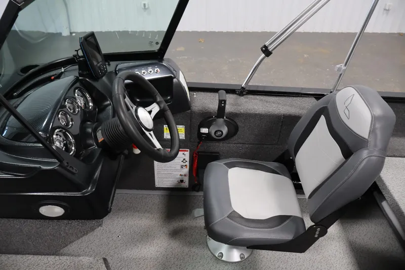 Slide: The Image of 2024 Lowe Fishing Machine 1775WT interior with steering wheel and seat. - 21