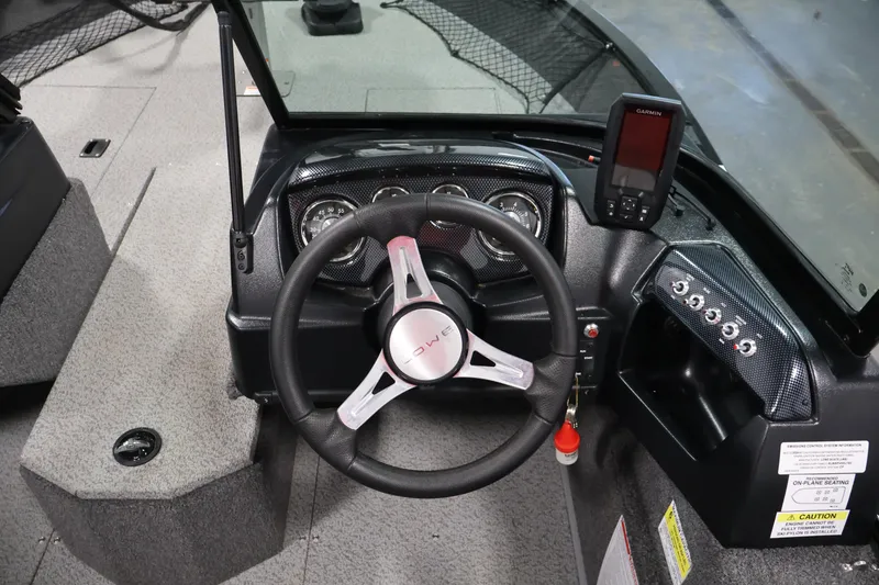 Slide: The Image of 2024 Lowe Fishing Machine 1775WT dashboard with steering wheel and Garmin device. - 22