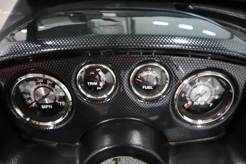 Slide: The Image of Dashboard of 2024 Lowe Fishing Machine 1775WT with speedometer, trim, fuel, and RPM gauges. - 24