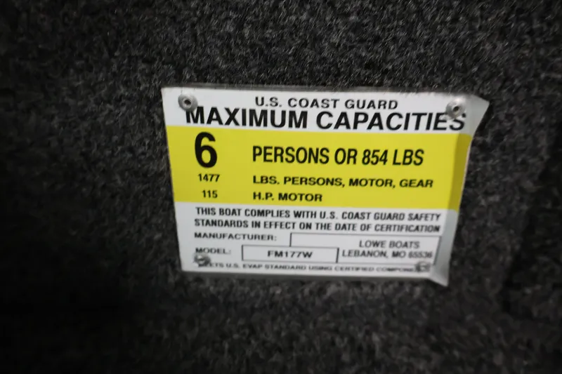 Slide: The Image of 2024 Lowe Fishing Machine 1775WT capacity label: 6 persons or 854 lbs, 115 HP motor. - 27