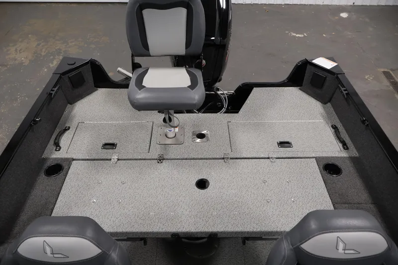 Slide: The Image of 2024 Lowe Fishing Machine 1775WT interior with seating and storage compartments. - 32