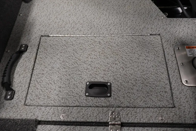 Slide: The Image of 2024 Lowe Fishing Machine 1775WT storage compartment with textured surface and handle. - 35