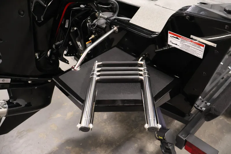 Slide: The Image of 2024 Lowe Fishing Machine 1775WT boat ladder and engine detail. - 38