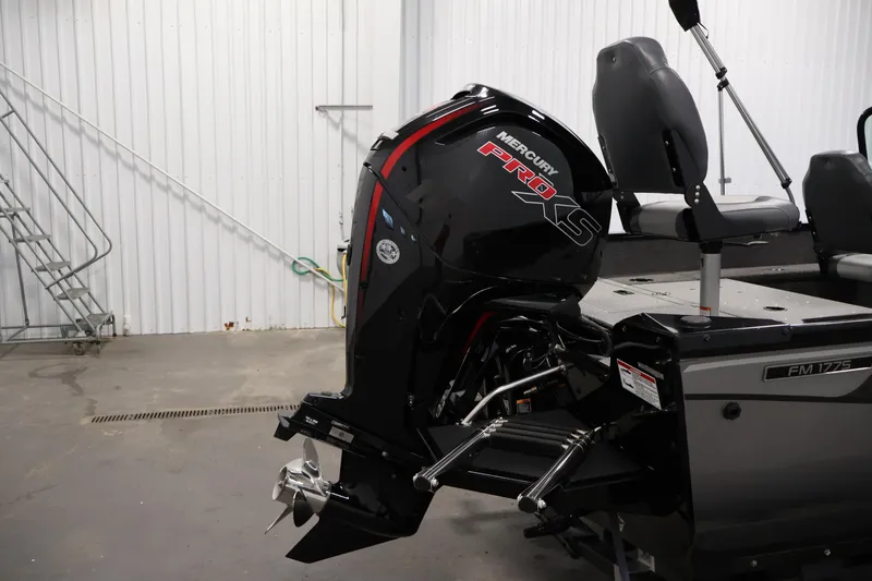 Slide: The Image of 2024 Lowe Fishing Machine 1775WT with Mercury Pro XS engine in a garage setting. - 40