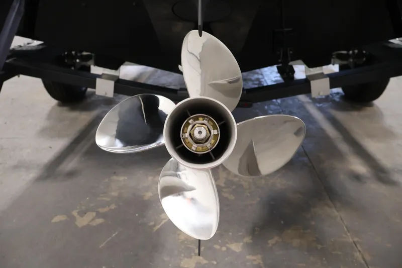 Slide: The Image of 2024 Lowe Fishing Machine 1775WT propeller, shiny metal blades, close-up view. - 43