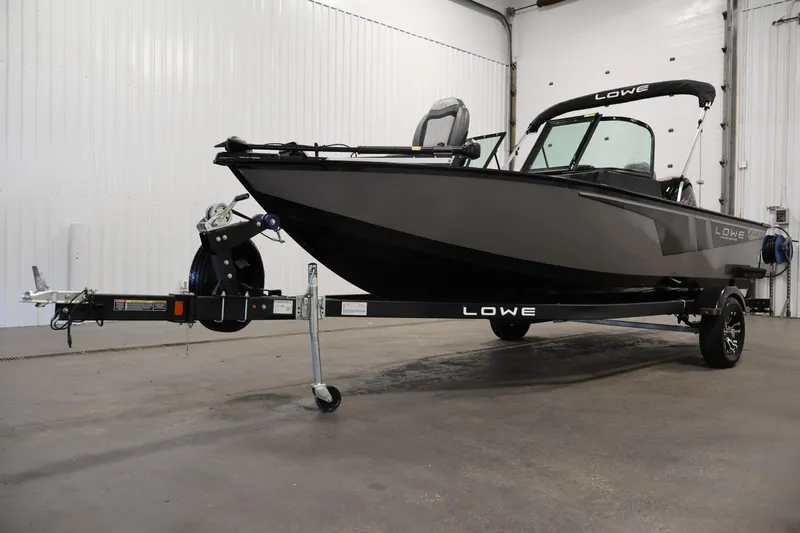 Slide: The Image of 2024 Lowe Fishing Machine 1775WT boat on trailer in indoor setting. - 46