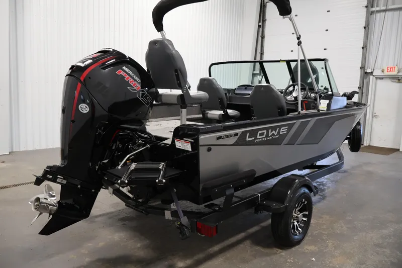 Slide: The Image of 2024 Lowe Fishing Machine 1775WT boat with Mercury Pro XS engine in a garage setting. - 5