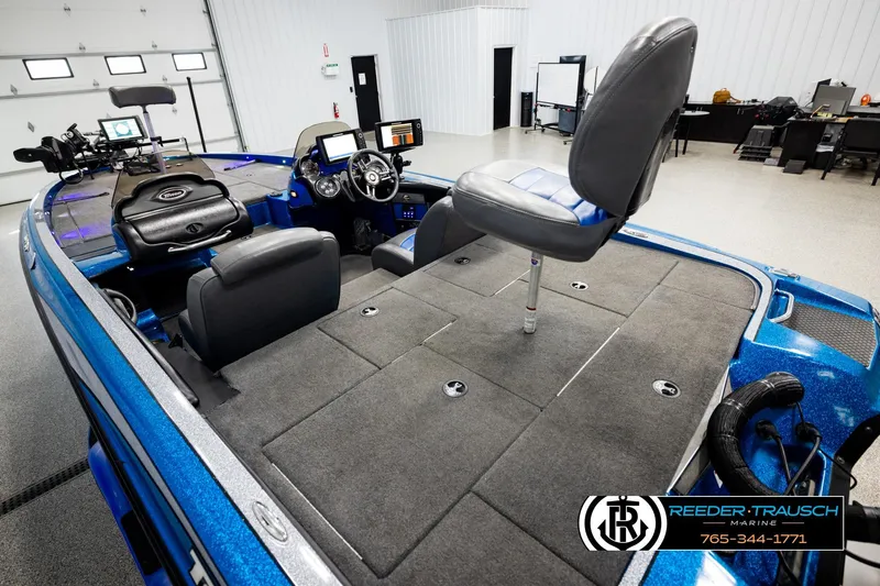 Slide: The Image of 2008 Triton 20X2 DC boat interior with seating and control panel in showroom. - 10